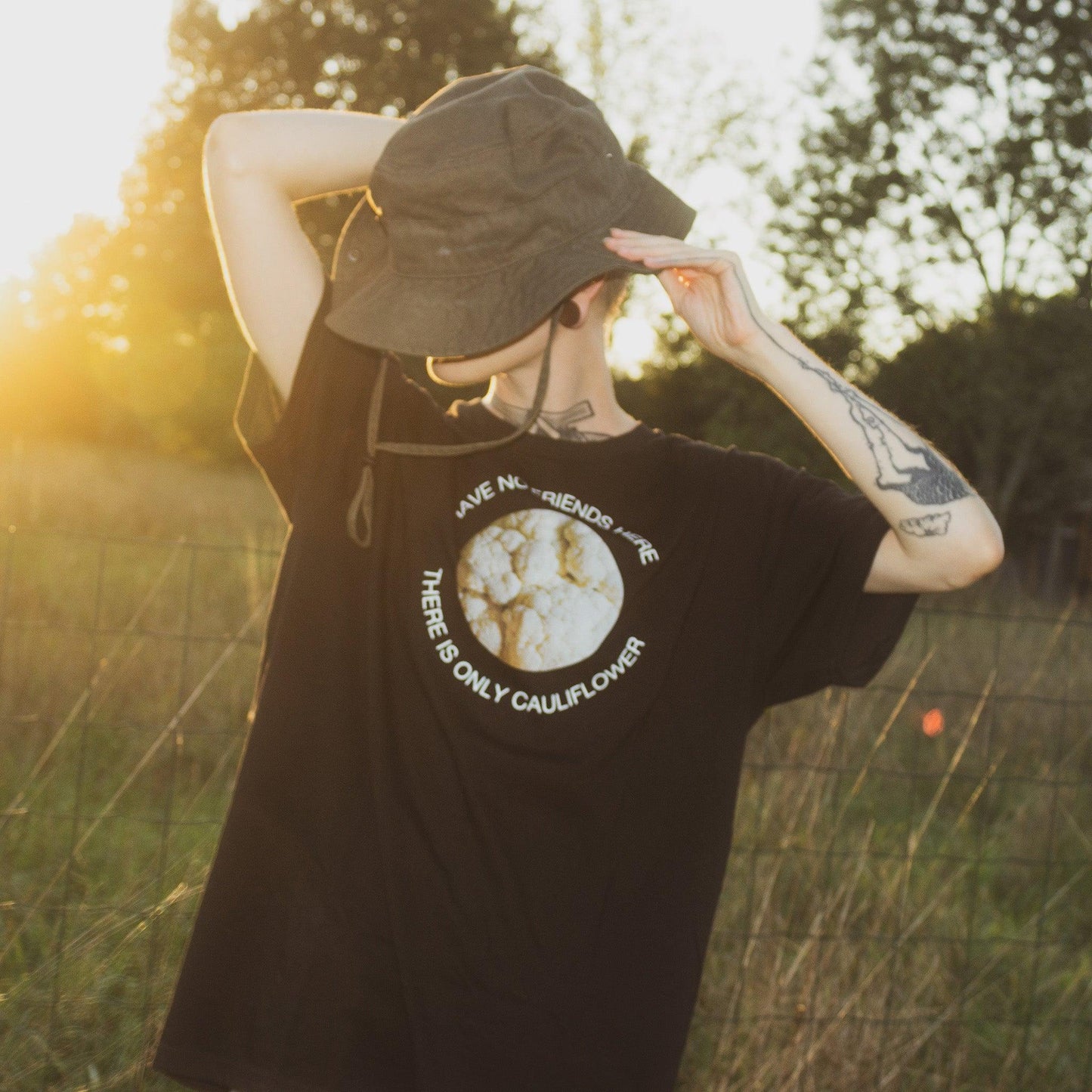 Model wearing Cauliflower unisex tshirt from Chaotic Kittens in the nature.