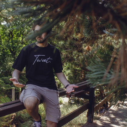 Model wearing twat oversized tshirt in nature.